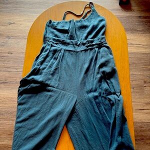 Teal one shoulder jumpsuit.